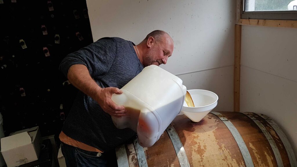 Gavin pours the wort into the barrel